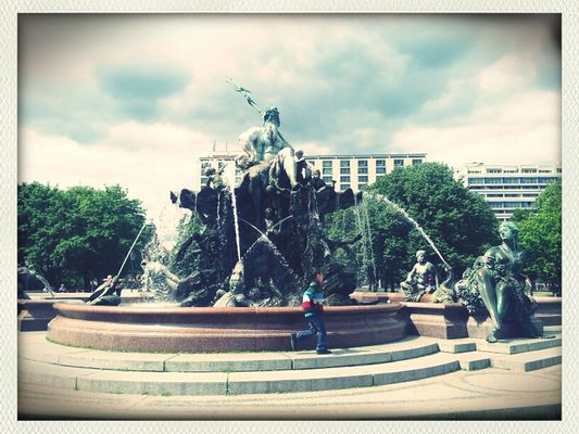playing children at Neptunbrunnen by Scout A. Loud