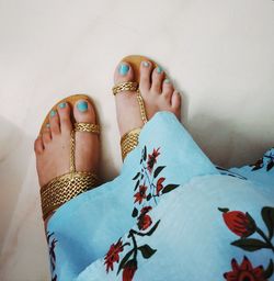 Low section of woman wearing shoes