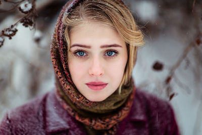 Close-up portrait of beautiful woman during winter