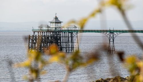 Bridge over sea against sky