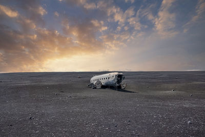 Broken military airplane wreck at famous beach in solheimasandur in sunset