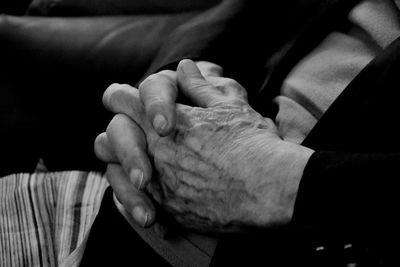 Close-up of man holding hands