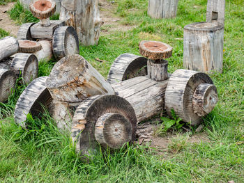 Wooden truck toy with others in outside children playground. natural material used for children cars