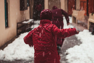 Rear view of person standing in snow