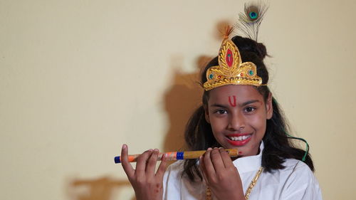 Portrait of smiling young woman using mobile phone
