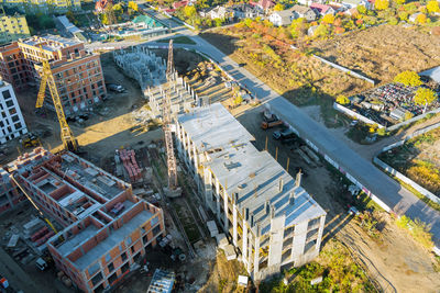 High angle view of buildings by road in city