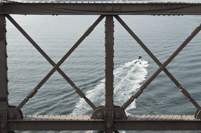 Ship sailing on sea against sky