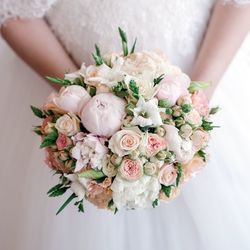 Midsection of woman holding rose bouquet