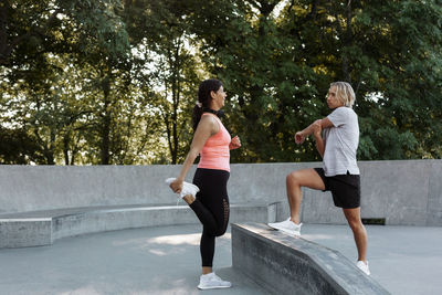 Couple exercising at skate park