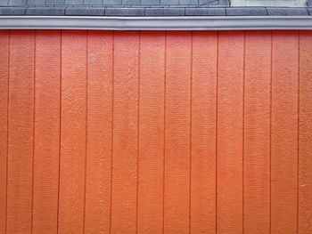 Orange wooden wall of shop