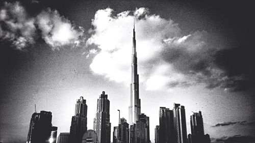 Low angle view of building against cloudy sky