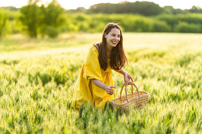 Young woman wearing mask on field