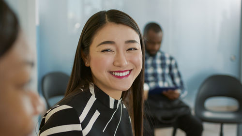 Portrait of young woman looking away