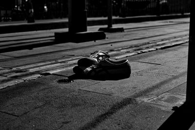 Close-up of skateboard on footpath