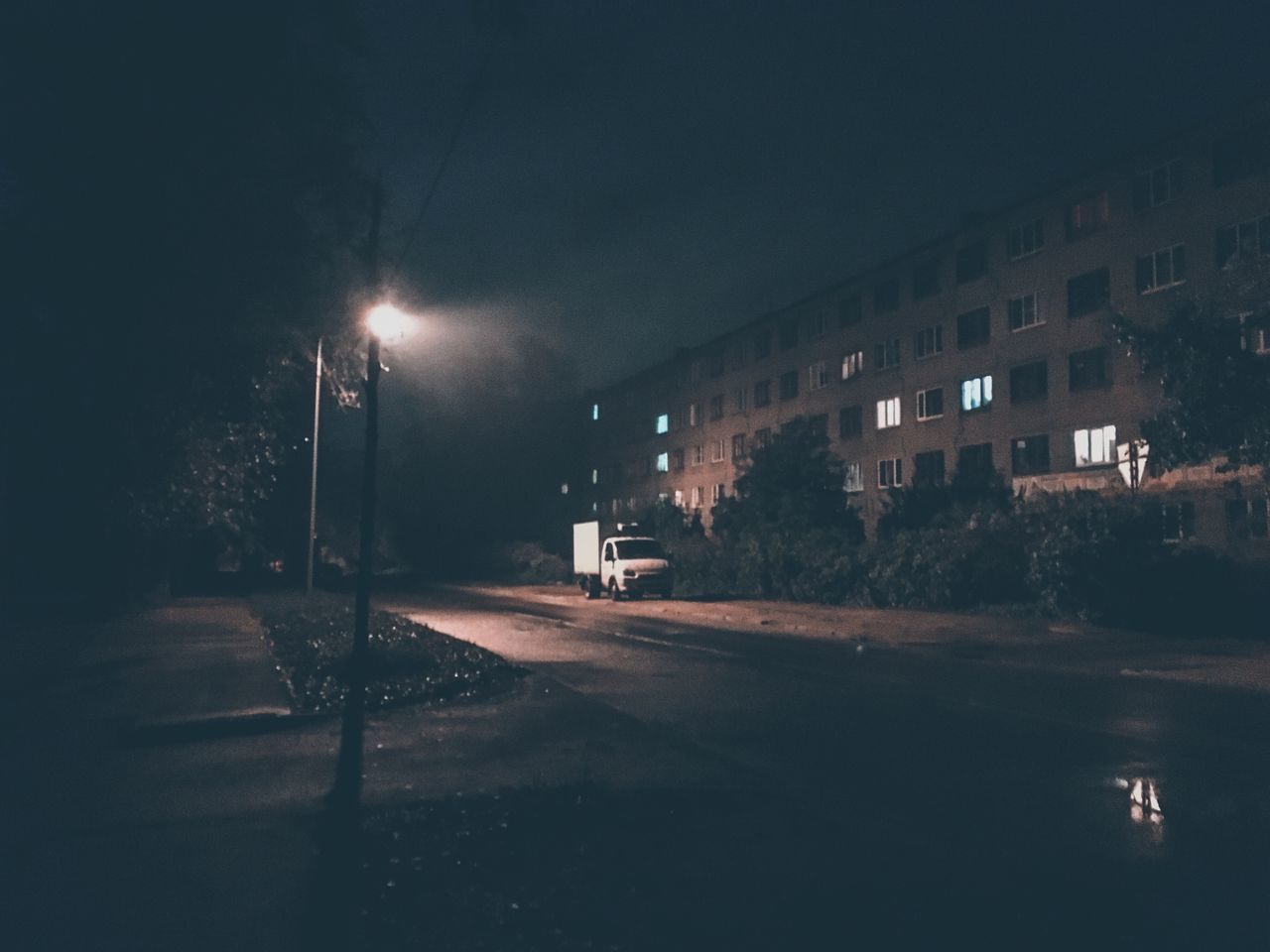 ILLUMINATED STREET AT NIGHT IN CITY