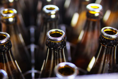 Close-up of beer glass with bottle