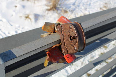 Close-up of padlocks on railing