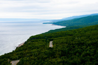 Scenic view of sea and buildings against sky