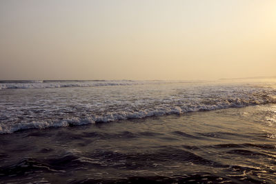 Scenic view of sea against clear sky during sunset