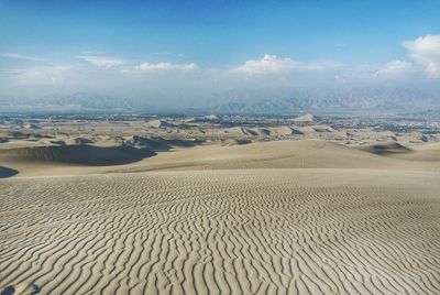 Aerial view of desert against sky