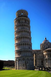 Low angle view of historical building against blue sky