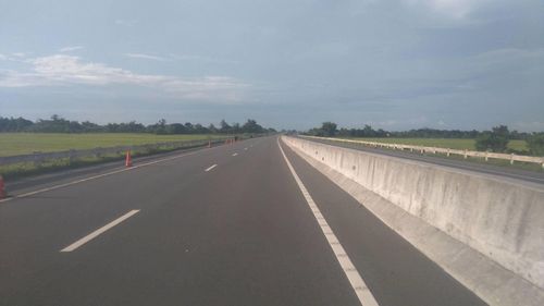 Empty road along landscape