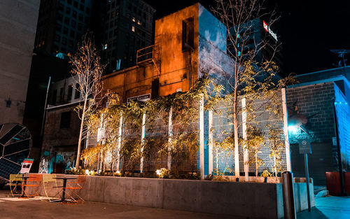 Low angle view of illuminated buildings at night