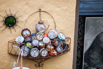 Antique clocks used as decoration on the facade of an old house in bruges