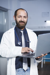 Portrait of young businesswoman working at clinic