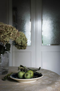 Close-up of vase on table at home