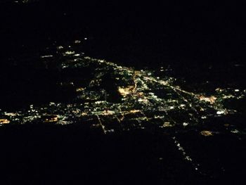 Aerial view of illuminated cityscape at night