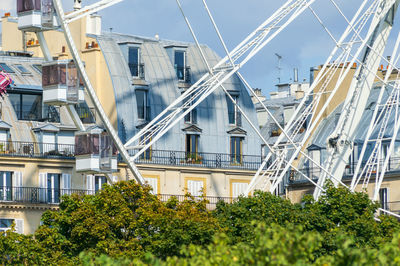 The huge ferris wheel of place de la concord in paris. here the contrast with the near by buildings