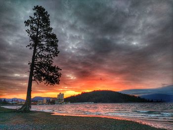 Scenic view of lake against dramatic sky