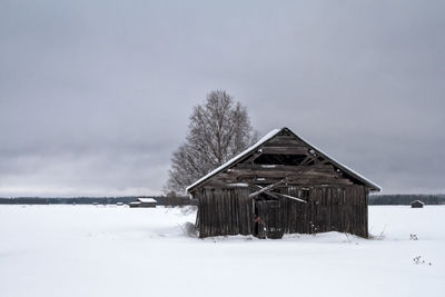 Old barn house under the grey skies