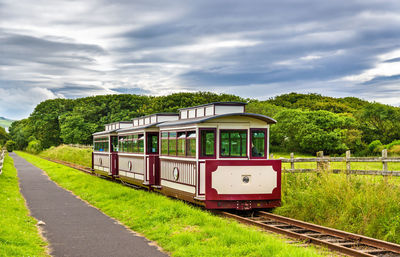 Train on railroad track against sky