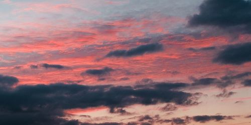 Low angle view of dramatic sky during sunset