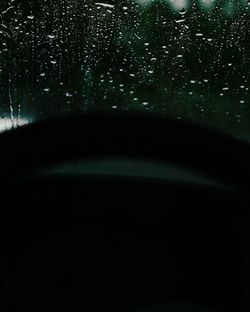 Close-up of water drops on airplane window