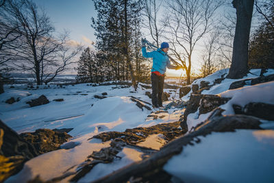 Packing away climbing rope at sun down