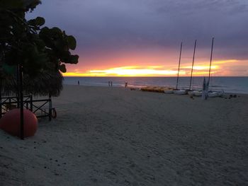 Scenic view of beach against sky during sunset