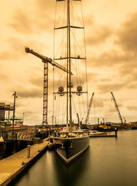 Sailboats in marina at sunset