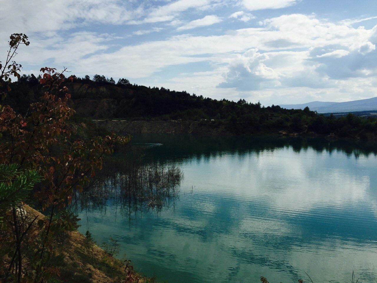 sky, water, tranquil scene, tranquility, lake, scenics, cloud - sky, reflection, beauty in nature, mountain, tree, cloud, nature, river, idyllic, plant, landscape, non-urban scene, cloudy, countryside