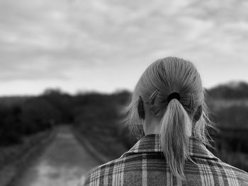 Rear view of woman looking ahead