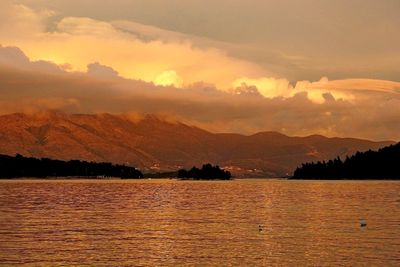 Scenic view of lake against sky during sunset