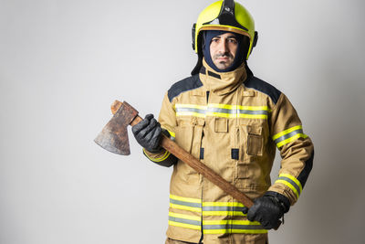 Full length of man wearing mask against white background