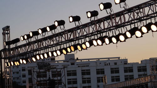 Low angle view of illuminated lights against clear sky