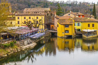 High angle view of borghetto sul mincio with the buildings reflecting on the water