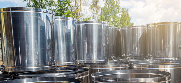 Low angle view of wine in container against sky