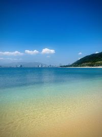 Scenic view of sea against blue sky