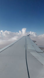 Low angle view of airplane flying in sky