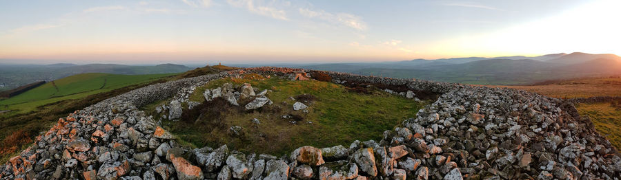 Panoramic view of landscape against sky during sunset